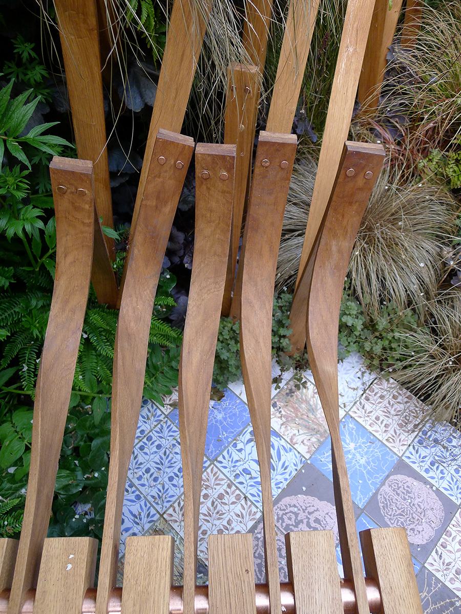 The steam bent 'EEG Wave' ends of the bench are secured with copper rivets